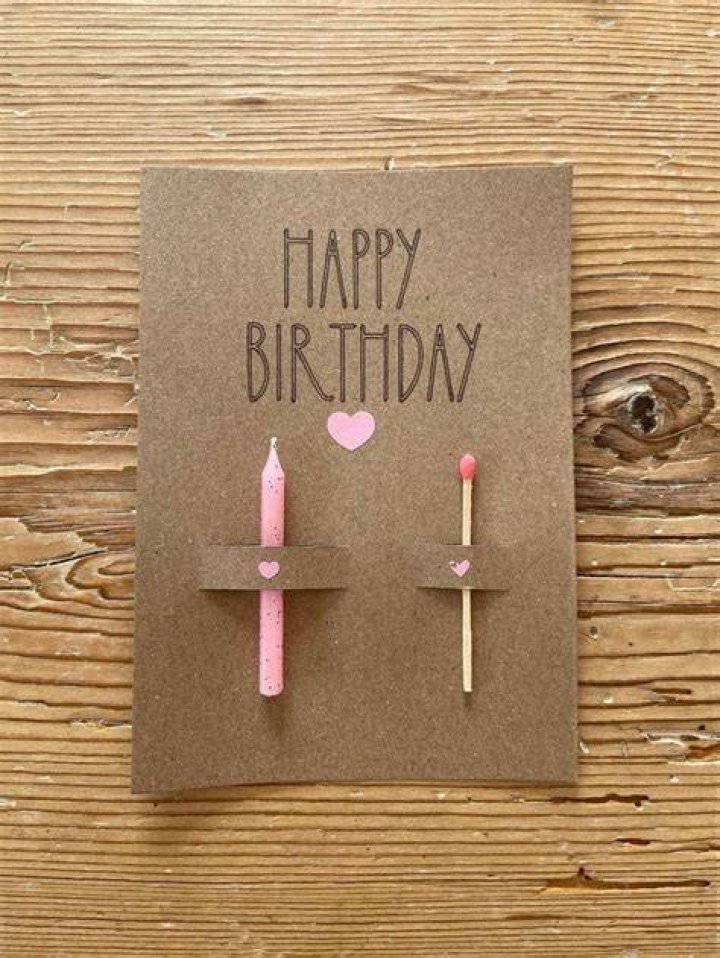 a birthday card with two blue butterflies on the front and bottom, in
