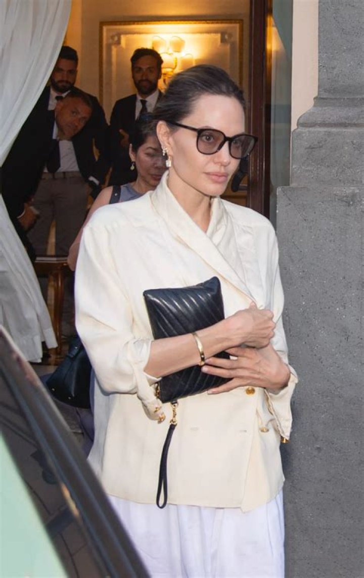 Angelina Jolie on vacation in Rome in a fashionable white dress Summer