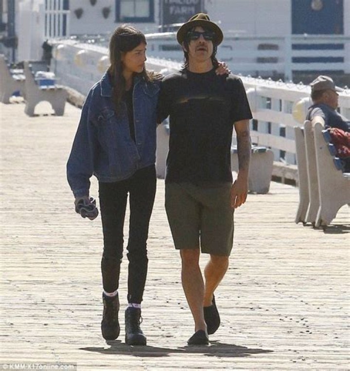 Anthony Kiedis and girlfriend Helena Vestergaard walk in each other's