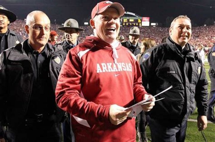 Arkansas Coach Bobby Petrino (shown with wife Becky), in a