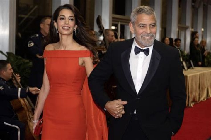 Clooney fixes wife Amal Clooney&rsquo;s dress on red carpet at Kennedy
