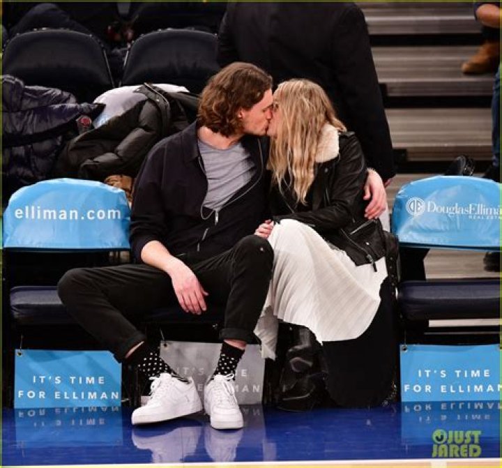 Dakota Fanning Shares Courtside Kiss with Boyfriend Henry Frye Photo