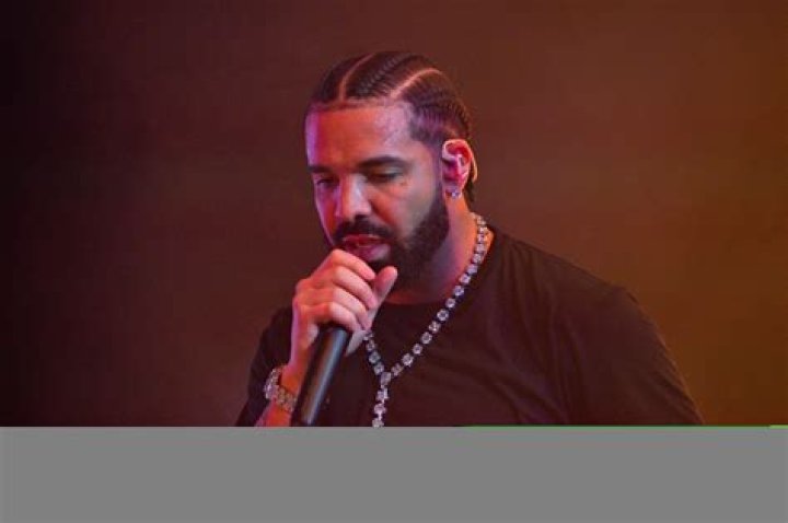 Drake finally reveals pictures of son Adonis as he poses with porn star