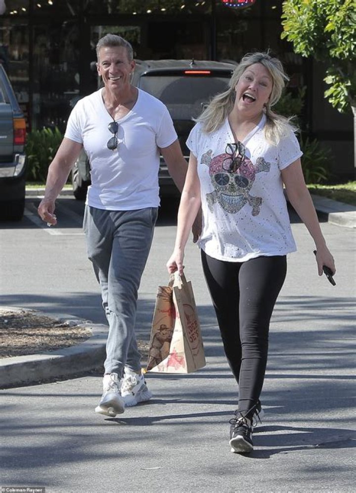 Heather Locklear beams with joy and laughs with fianc&eacute; Chris Heisser