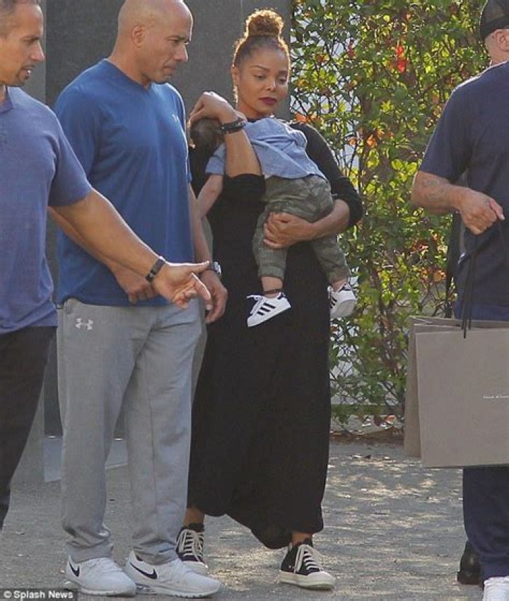 Jackson gently cradles baby son Eissa in Hollywood Daily Mail