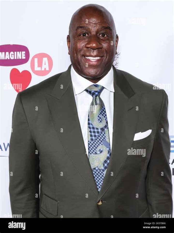(LR) Former NBA Player Earvin "Magic" Johnson and Earlitha "Cookie