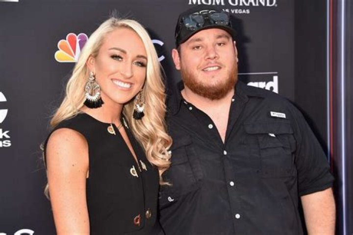 Luke Combs + Wife Nicole Ravish in Red on the 2023 CMAs Carpet