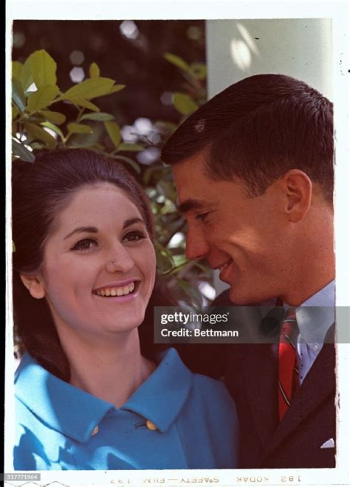 Lynda Bird Johnson Robb in front of White House Christmas tree with