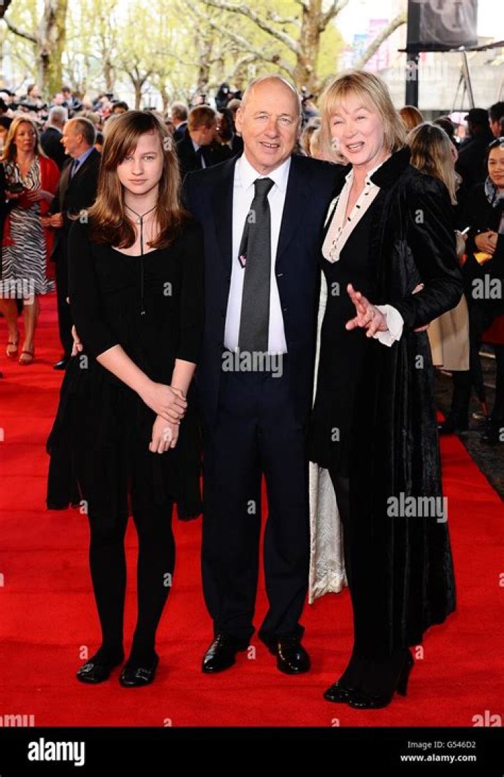 Mark Knopfler with wife Kitty and daughter Isabella arriving for the UK