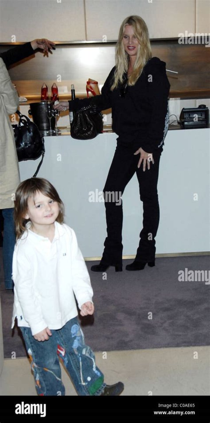 Nicollette Sheridan has her hands full as she shops for shoes with her