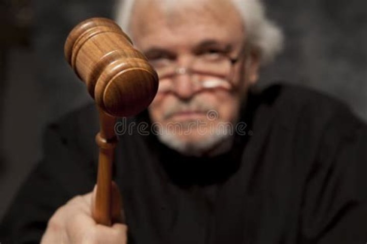 Old Male Judge in a Courtroom Striking the Gavel Stock Image Image of