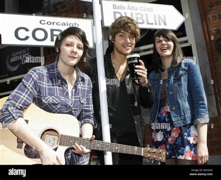 Paolo Nutini with twin sisters Louise Macnamara and Ellie Macnamara