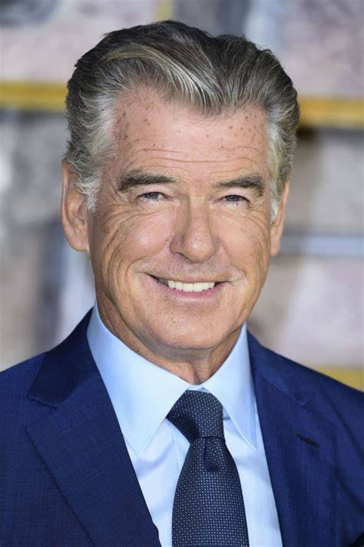 Pierce Brosnan's wife steals the show in sheer dress as she celebrates