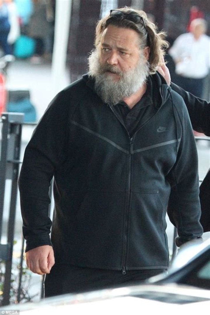 Russell Crowe arrives in Sydney with his two young sons
