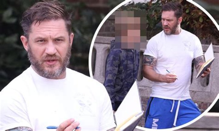 Tom Hardy cuts a casual figure as he goes shopping with his eldest son