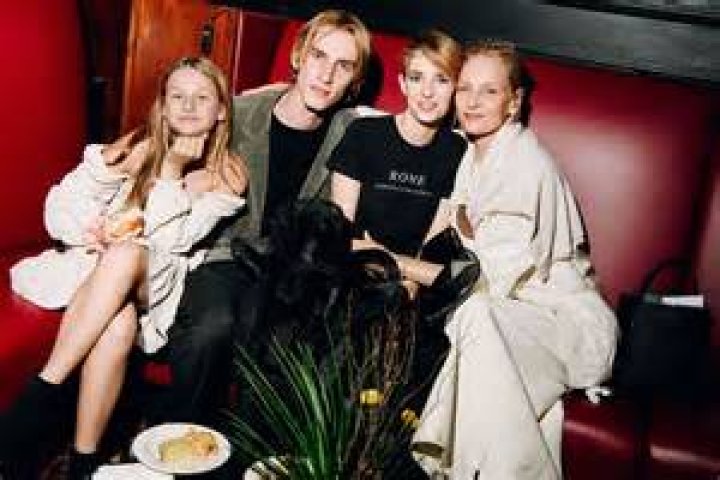 Uma Thurman covers up in baggy clothing at Art Basel bash... and has her limelight stolen by